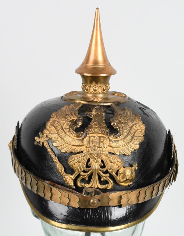 WW1 GERMAN PRUSSIAN OFFICER'S PICKELHAUBE: Very salty Prussian officer’s spiked helmet. Decent body and front and back visors. Cockades, chin scales and helmet plate all look to be original to it. Liner and sweatband are like the outside wel