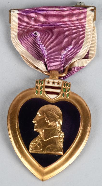 WWI NAMED & NUMBERED PURPLE HEART MEDAL: Split brooch early contract pre-World War II style Purple Heart medal, numbered "46639" and officially engraved on the reverse to "Emilio Genozzi." Emilio Genozzi was an immigrant from Italy, born in 