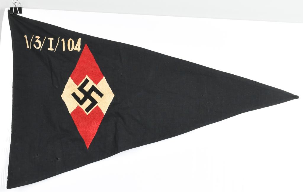 WWII NAZI GERMAN HJ HITLER YOUTH UNIT FLAG: Early 19 x 29 1/2 inches triangular double sided multi-piece cotton construction pennant. Embroidered HJ diamond with 1/3/I/104. Reverse side has the embroidered crest of the town of which the unit be
