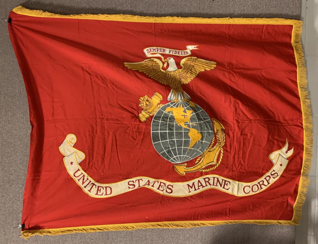 WWII US EMBROIDERED SILK US MARINE CORPS FLAG: Approximately 64" x 48" double-sided silk flag with gold tassels at the edges, and a fully embroidered US Marine Corps Eagle, Globe, and Anchor insignia at the center. United States Marine Corps emble
