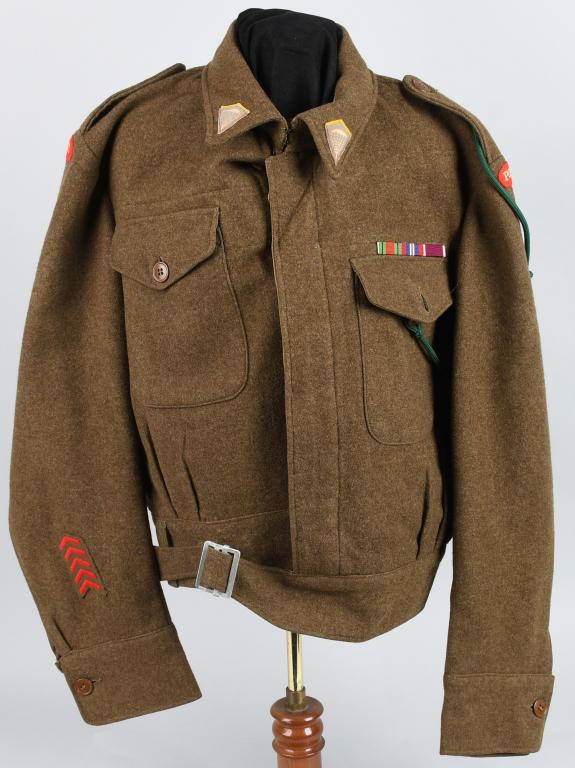 WWII POLISH PARATROOPER BATTLE DRESS JACKET: World War II British army style battle dress jacket with Paratrooper inisignia at the collars, sewn ribbon bars on the chest, a green aiguilette on the left shoulder, and "POLAND" arc patches on eithe