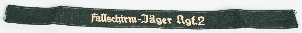 WWII NAZI GERMAN Fallschirm-Jager Regt 2 CUFFTITLE: Fallschirm-Jäger, Regiment 2 Luftwaffe cufftitle with off-white gothic lettering on a green wool-doeskin. Insignia is in excellent condition. 2. Fallschirmjäger-Division The 2. Fallschirmjäger-Divi