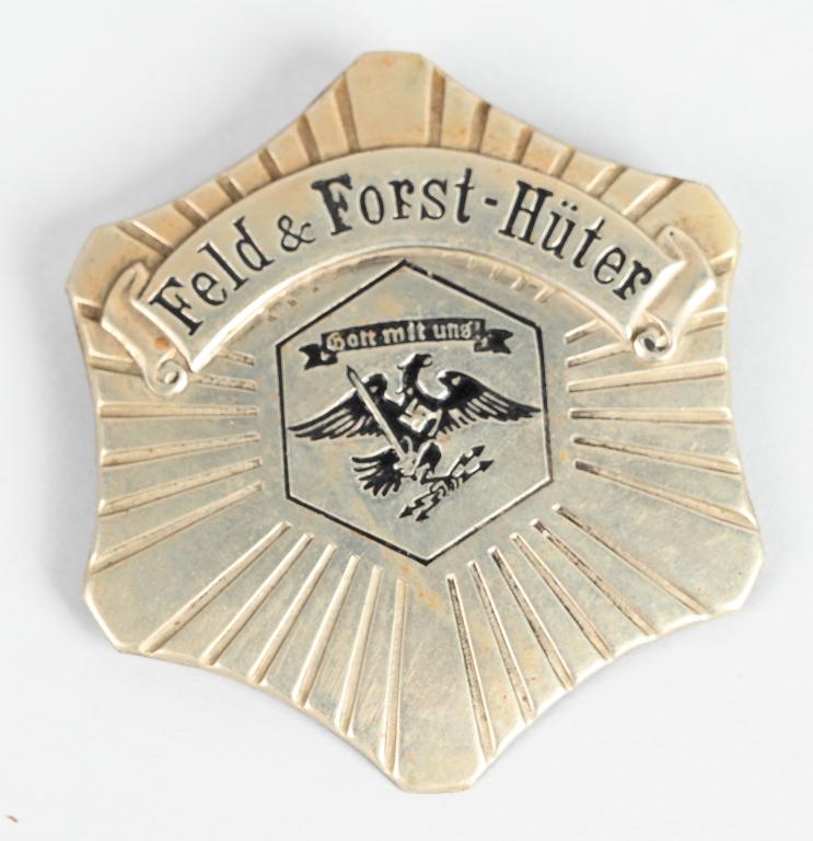 WWII NAZI GERMAN Feld & Forst Hüter POLICE BADGE: Prussian State Forestry Office service badge for Field & Forest Guardians. Nickle silver hollow embossed with a stunningly detailed eagle with a swastika to it's chest with a safety pin back. Excellen
