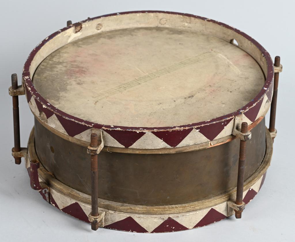 WWII NAZI GERMAN HITLER YOUTH HJ MARCHING DRUM: A 38cm diameter drum with skins to either face separated by a 16.5cm tall brass surround with upper and lower wooden bands. The thigh brace is riveted to the lower band beneath where the drum hanger w