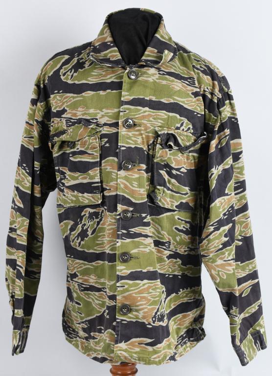 VIETNAM SILVER (TDS) TIGER STRIPE SHIRT JACKET USL: Stellar, Caterpillar club membership grouping with original membership card, 14k caterpillar pin, trigger pull from the ejection seat, command pilot wings and photograph album with several documents.