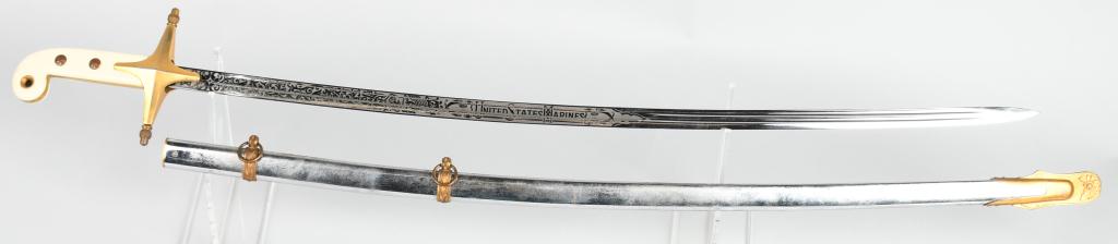 VIETNAM WAR ERA USMC OFFICER MAMELUKE SWORD: United States Marine Corps Officers Mameluke Ceremonial Sword ca. 1950s - 1970s. Maker marked by Wolf Brown of Germany at the ricasso . Blade is unnamed. Etched with Eagle Globe and Anchor and foliate