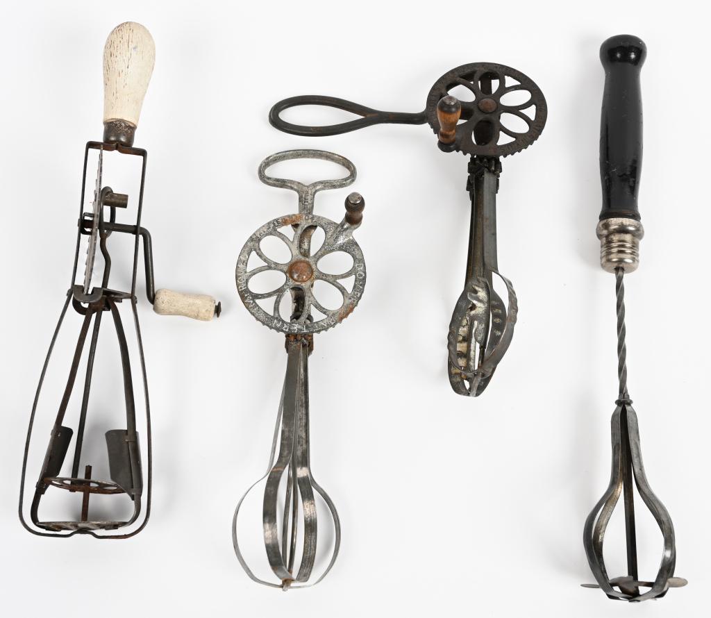 4- ANTIQUE KITCHENWARE EGG BEATERS: Lot includes a Holt's cast iron side handle beater, a retractable whisk, a Dover cast iron beater and a Benson Beater. Largest is 13 1/2", Very Good