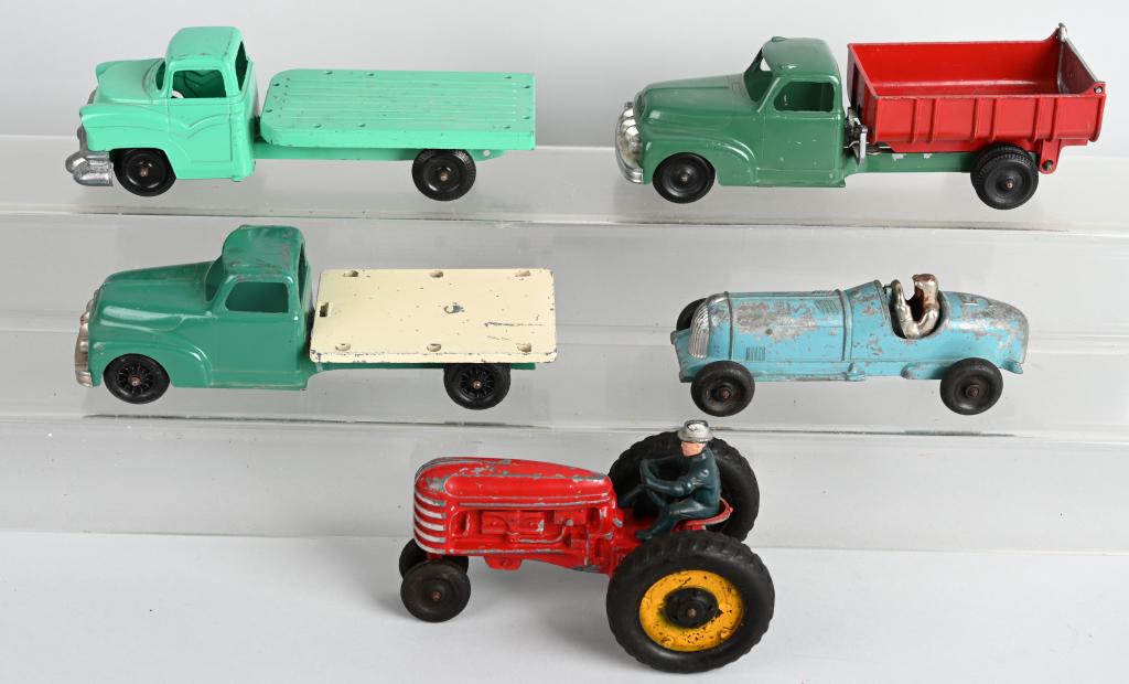 5- HUBLEY KIDDIE-TOY DIECAST VEHICLES: Lot includes Dump truck, Tractor, Race Car and two stake trucks missing stakes. Largest is about 9 1/2", Condition varies. Overall Very Good