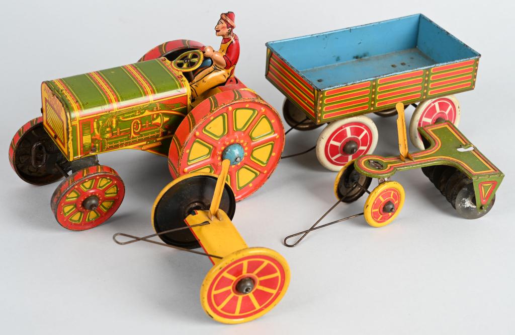 MARX Tin Windup AMERICAN TRACTOR & IMPLEMENTS: Very early Marx Tractor. All original with 3 Implements. Very nice colors. Windup needs adjustment. Tractor 8" Excellent