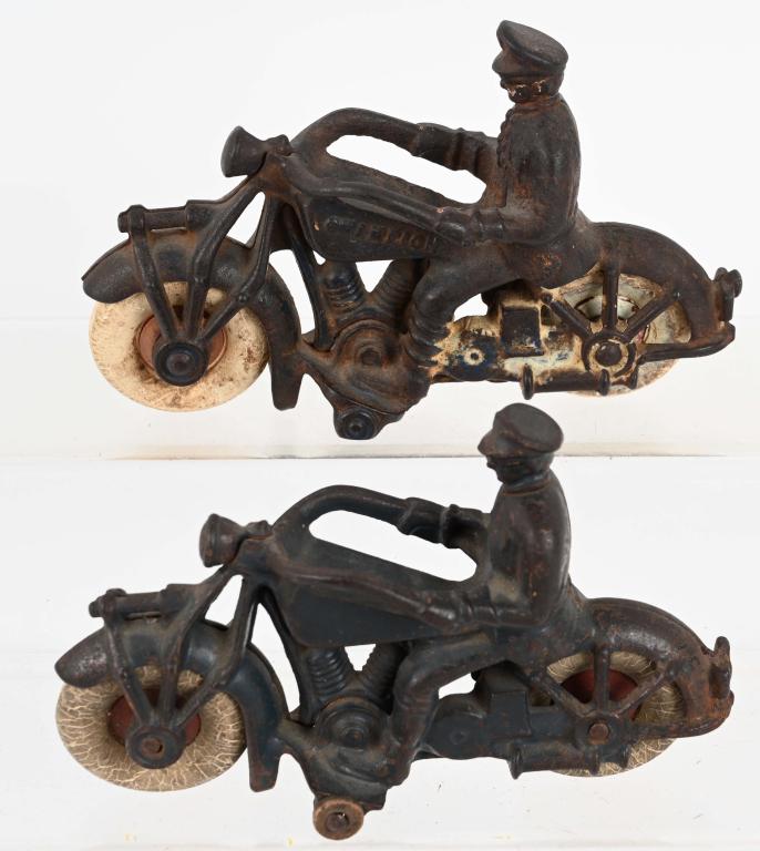 2- CHAMPION LARGE SIZE cast iron MOTORCYCLES: Two different version of th large size 1930's Champion cast iron motorcycle toy. One has a chipped front fender and chipped tail light. 7" Good