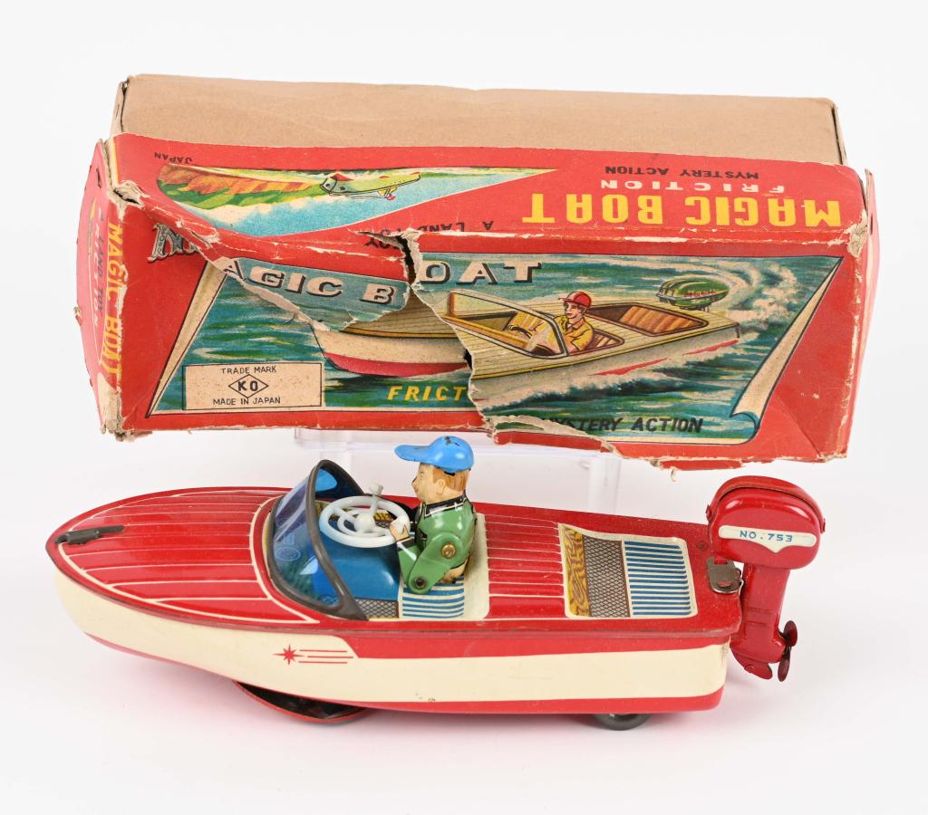 JAPAN TIN WINDUP MAGIC BOAT w/ BOX: Japan windup friction Boat with Outboard Motor. Great colors. Works. With Box. 9" Excellent