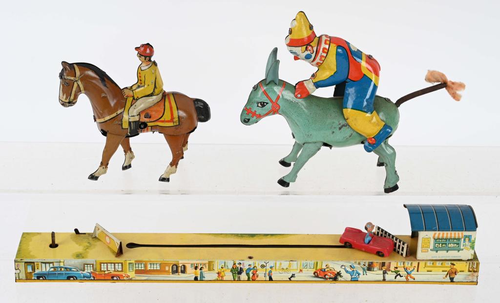 3- GERMAN tin windup TOYS: Lot includes a 14" Arnold windup car on tin base, a 5 1/2" Clown on Donkey, and a pre war Germany Jockey on Horse. All worked when tested. Light wear. Very Good-Excellent