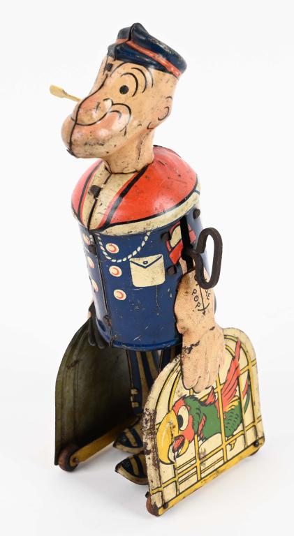 MARX TIN WUNDUP POPEYE & PARROT CAGES: Nice graphics. Has wear. Pipe replaced. Windup works. 8" Good