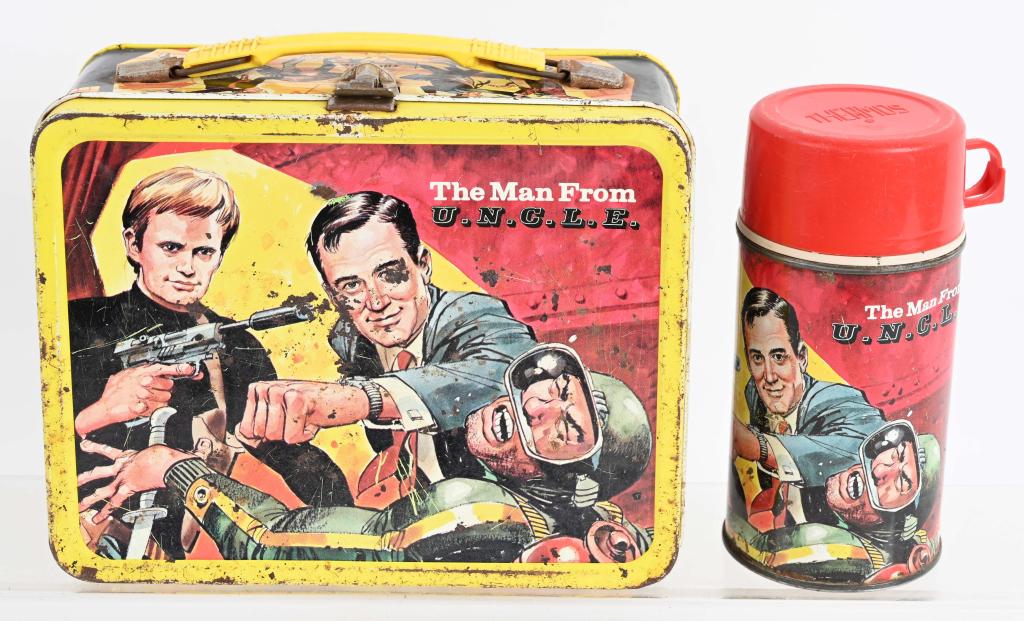 1966 MAN FROM UNCLE LUNCH BOX: Original box and thermos. Nice graphics, but has general wear, scuffs and spots of light rust. Good