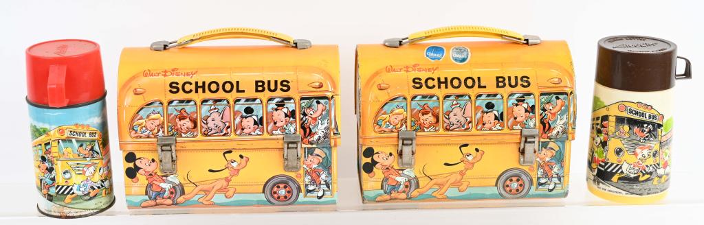2- WALT DISNEY SCHOOL BUS DOME LUNCH BOXES: Two original School Bus lunch boxes include different versions of the thermos. Both have general wear, rubs and paint loss. Overall Very Good