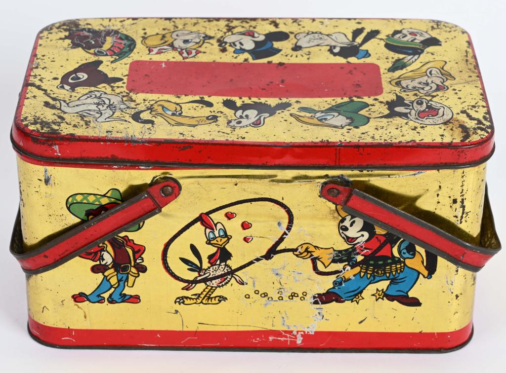 SCARCE ITALIAN DISNEY LUNCH PAIL: Scarce Disney lunch tin has many characters depicted including Mickey Mouse, Pluto, Bambi, Dopey, Donald Duck, Goofy and many more. Has some bending, scuffs and scratches. Nice colorful graphics. 10" 