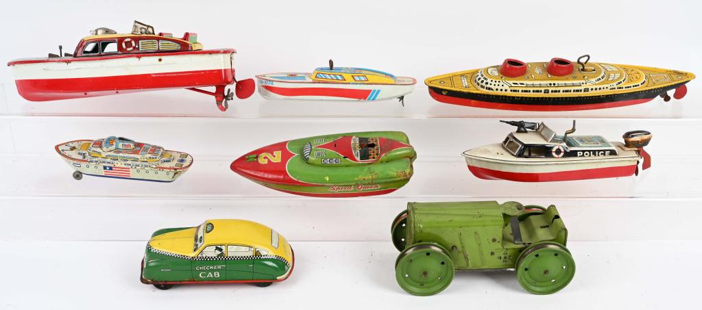 8- VINTAGE TIN TOYS: Lot include 6 tin boats, a Courtland Checker Cab, and a Marx Tractor. As-Is