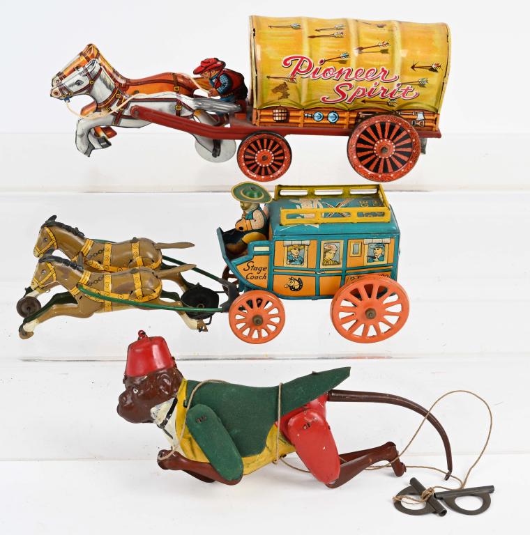2- VINTAGE JAPAN tin friction WAGONS & MORE: Lot includes 2 very detailed Japan tin toy horse drawn wagons. Also includes is a nice early Lehmann Germany Climbing Monkey. As-Is