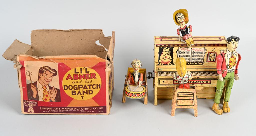 UNIQUE ART Tin Windup LIL ABNER BAND: All original and complete. Great colors and graphics. Very nice character toy. Windup works. 9" Excellent