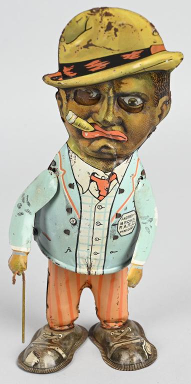 MARX Tin Windup ANDY WALKER: Early Marx character toy. "Andy" from the Amos and Andy Radio Show. Has some wear. Arms are correct replacements. Works. 11" Very Good