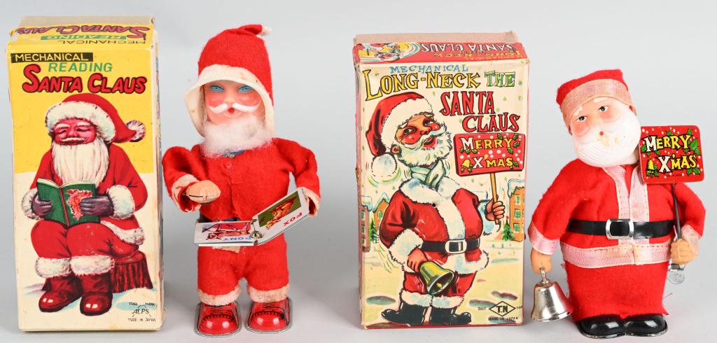 2- JAPAN windup SANTA CLAUS TOYS w/ BOXES: Nice lot includes Reading Santa Claus along with Long Neck Santa Claus. Both worked when tested, and include the colorful original boxes. Largest is 6 1/2". excellent