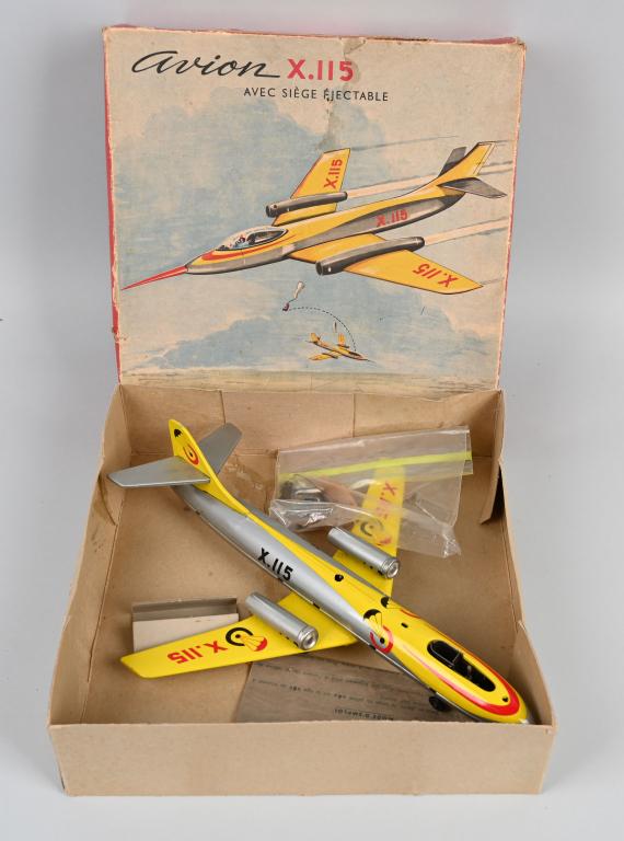 JOUSTRA TIN WINDUP JET w/ EJECTABLE SEAT w/ BOX: All original and looks never played with. Complete with Pilot with Parachute and Canopy Cover. Boxed. 13" Excellent