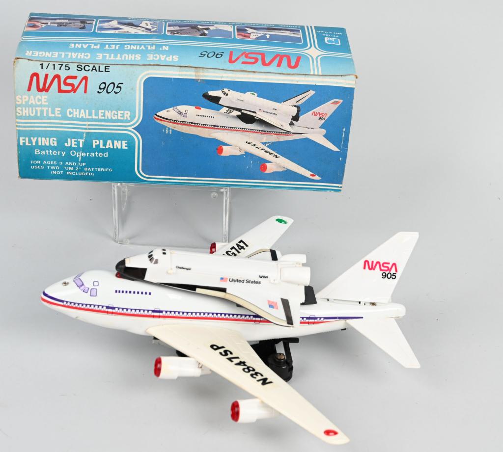 Battery Op SPACE SHUTTLE CHALLENGER & JET PLANE: All original battery operated Flying Jet Plane with Space Shuttle Challenger. Made in Korea. Worked when tested. Boxed 12" Excellent