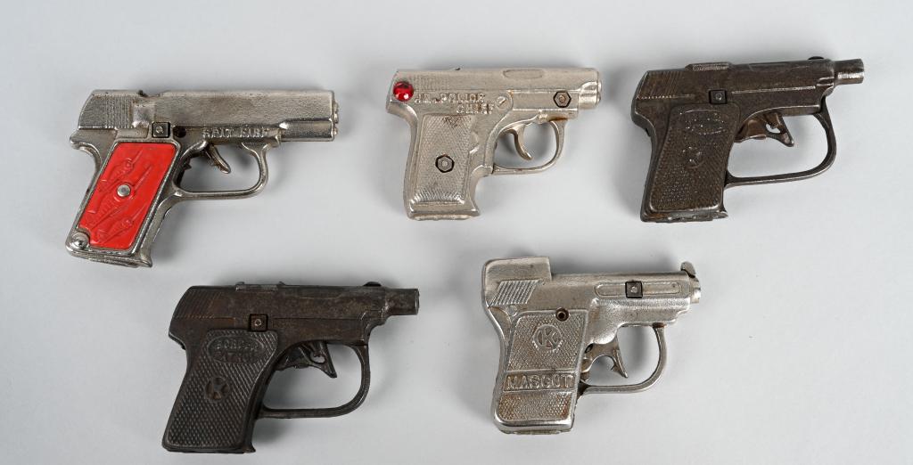5- VINTAGE cast iron CAP PISTOLS: Nice lot includes Mascot, 2- Border Patrol, JR. Police Chief, and Spit Fire. All worked when tested. The Spit Fire has a chipped grip. Largest is 5", Condition varies, Overall Very Good