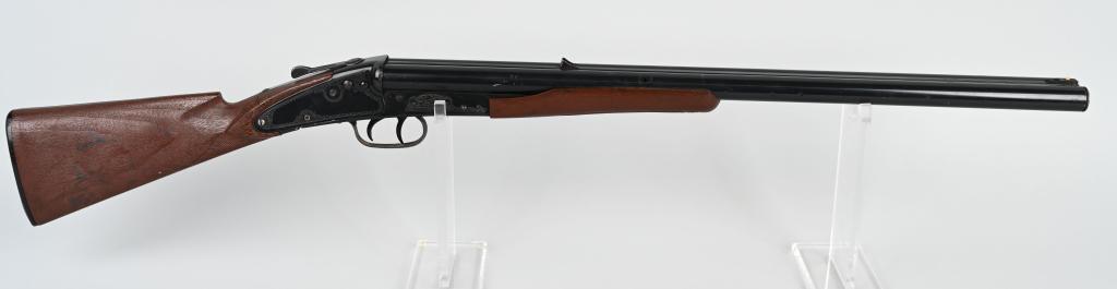 DAISY MODEL 21 DOUBLE BARREL BB GUN: This version has a plastic buttstock and plastic forearm. Action worked when tested. Light wear. There is a crack in buttstock by wrist. 37", Very Good
