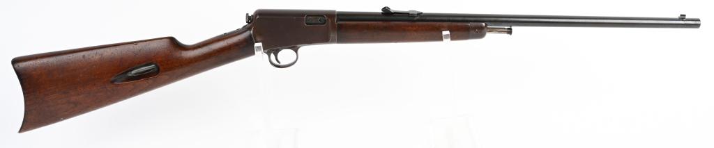 WINCHESTER MODEL 1903 SEMI AUTO RIFLE: SERIAL 114771 BARREL 20". CALIBER .22 AUTOMATIC. MADE IN 1928. Features round barrel, stock fed tube magazine, original sporting sights, straight grip walnut stock and blue finish. Barrel is a smooth 