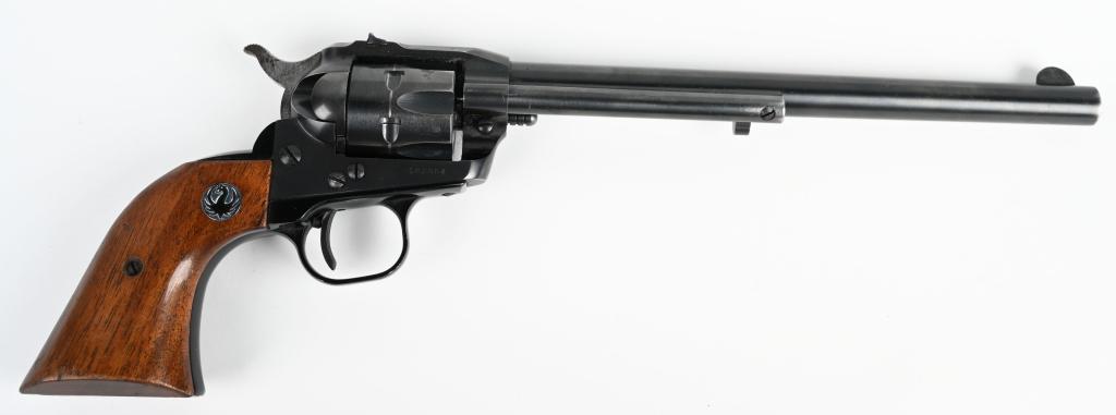 EARLY RUGER 9 1/2" SINGLE SIX REVOLVER (1960): Serial #162984. One of the harder to find Ruger .22 revolvers is this early long barreled version of the classic Single Six revolver. Made in 1960, it features a six shot fluted cylinder, wind drift r