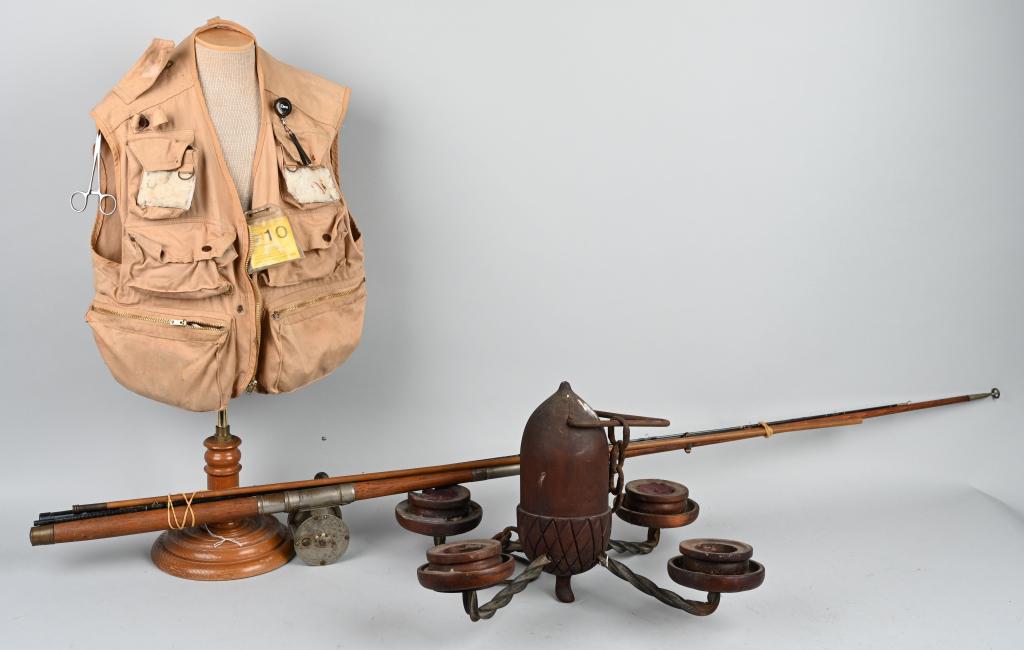 VINTAGE FISHING EQUIPMENT & CANDELABRA: Complete your vintage fishing cabin decor with this hand-carved wood and iron candelabra, measuring approximately 24" x 16" with a carved acorn in the center. Also includes fishing vest with tackle in