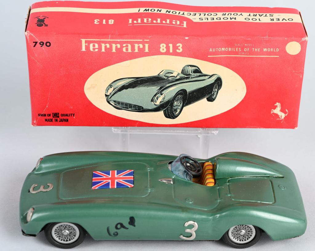 JAPAN tin friction FERRARI 813 RACER w/ BOX: Wonderful Ferrari 813 racer with tin British flag on hood. Friction motor worked well. Has price written on left front fender. Great toy and box. 8 1/2", Excellent-Near Mint