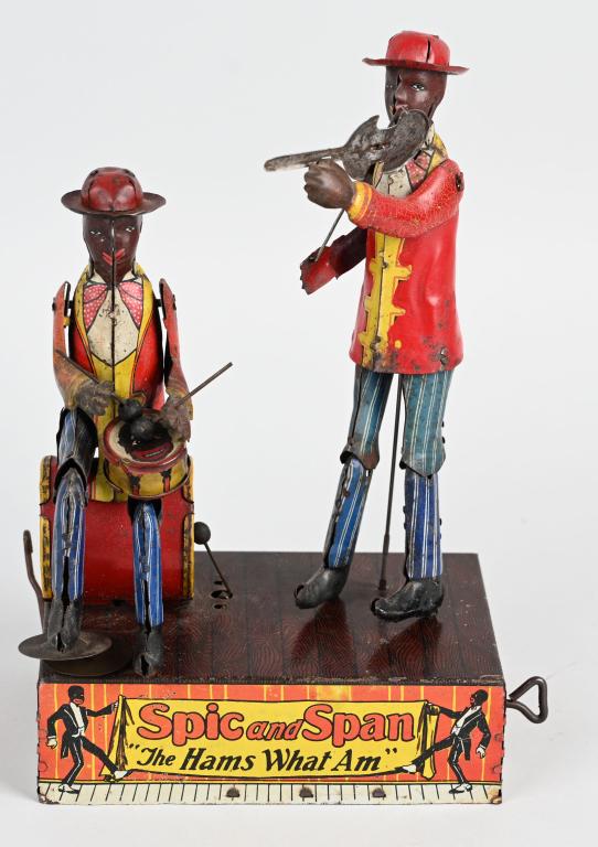 MARX Tin Windup SPIC and SPAN: Great early Marx toy. All complete with great graphics and colors. Windup works. Small drum partial professionally replaced and one of the drummers legs tabs are off, but legs stays in place and displ