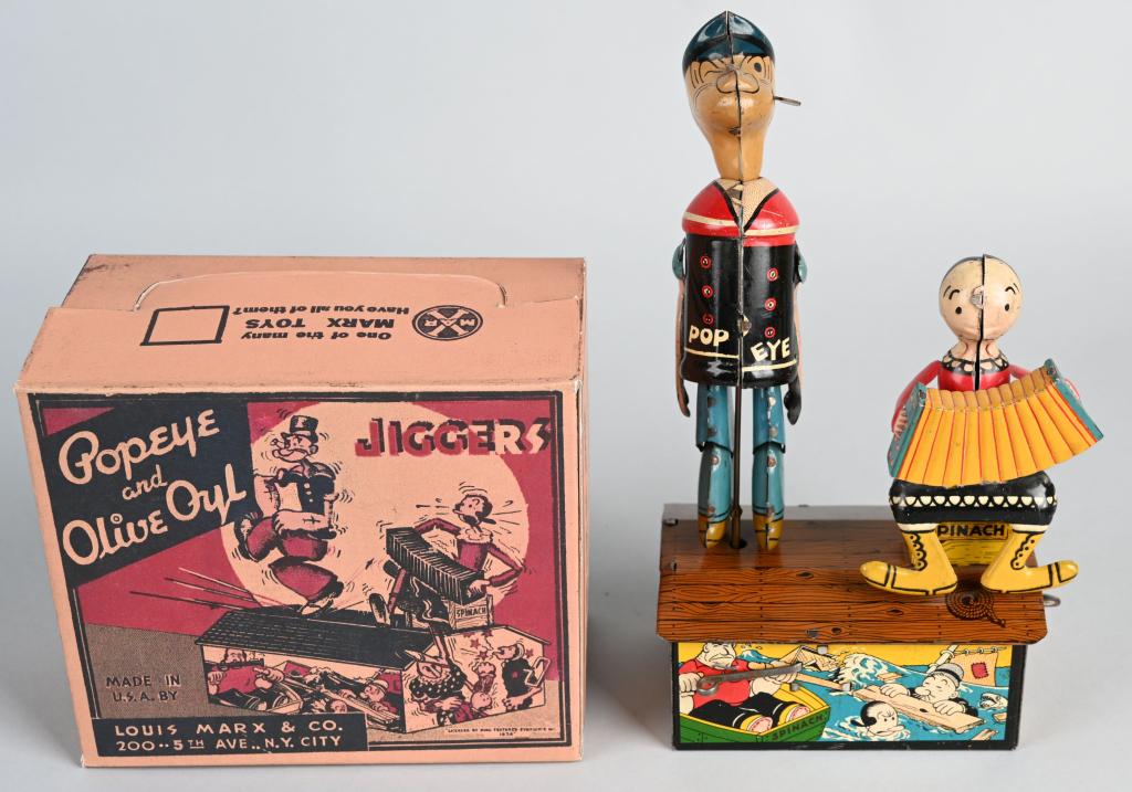 MARX Tin Windup POPEYE & OLIVE OYL JIGGERS: Very nice early Popeye toy. Great graphics and colors. All original. Windup works. With quality reproduction box. 9" Excellent