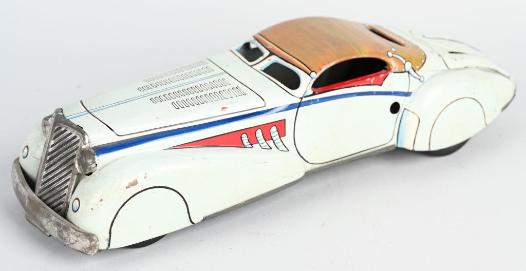 MARX PROTOTYPE TIN FRICTION STREAMLINE COUPE: Great looking Marx Prototype. Tin friction Streamline Coupe thats been hand painted with very nice details. Has the looks of a Super Charged Auburn. Marked on bottom X3467 ERIE 11-18-53. Has unusual f