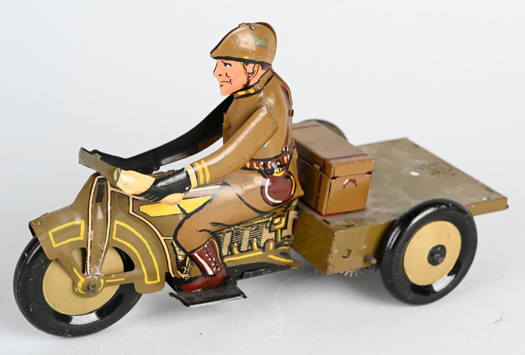 MARX PROTOTYPE TIN WINDUP MILITARY MOTORCYCLE: Unique tin windup Marx Prototype Military Motorcycle. Hand painted with nice details. The motorcycle is based off the Speed Boy Delivery. Made to look like a Military Flatbed Delivery Motorcycle. Has 