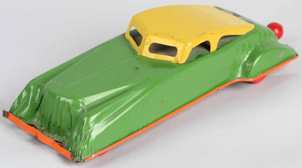 BUFFALO Tin Windup AUTOMOBILE: All original with unusual pull windup in rear of the car that is common on Buffalo Toys. Toy has stamp on bottom Made in Canada which seems unusual? Works. 15" Excellent (From the Danny Kubert Collect