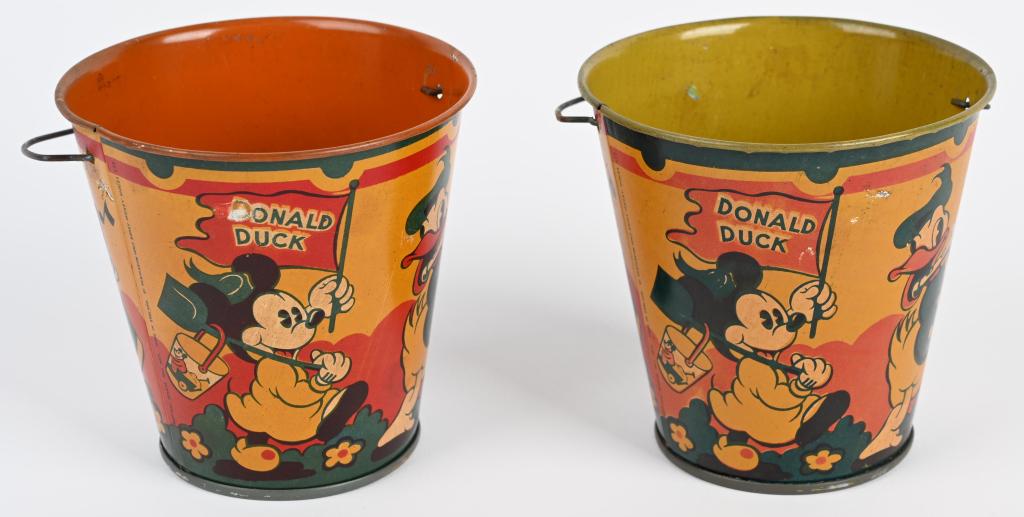 2- 1930's DONALD DUCK & MICKEY MOUSE SAND PAILS: Nice pair of original 1930's sand pails with Donald Duck, Mickey Mouse and other Disney Characters. Made by Happynak in England. These are old store stock and are excellent with light storage wear. Ni