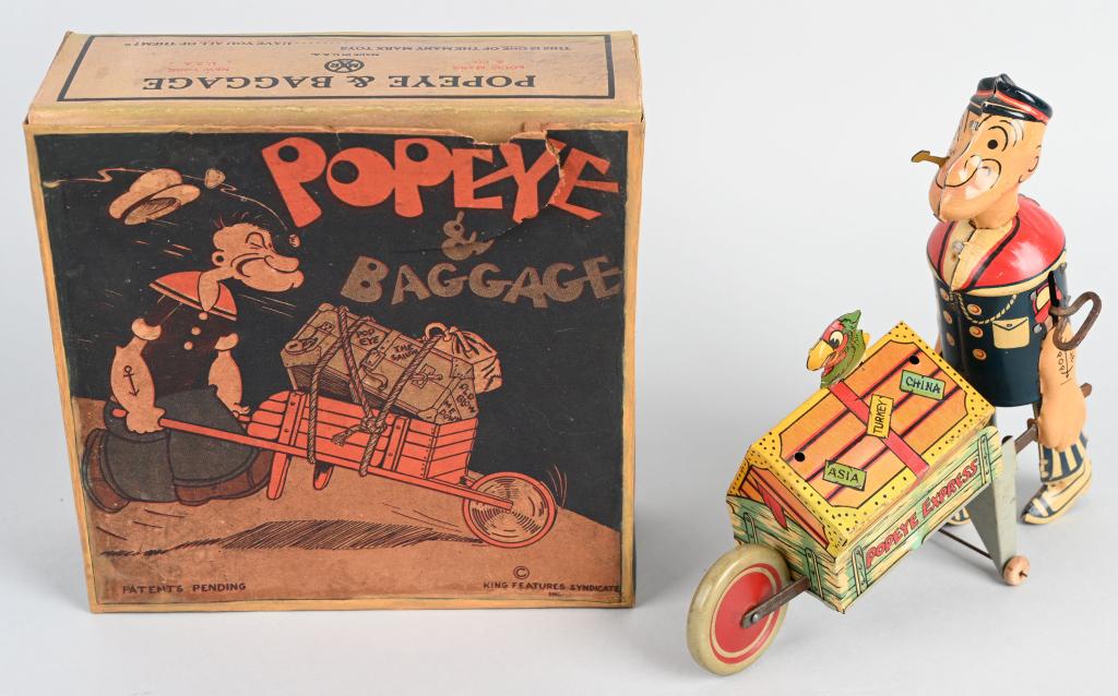 MARX Tin Windup POPEYE & BAGGAGE w/ BOX: Very nice Popeye & Baggage. Fixed Parrot version. Very nice colors. Windup works. Comes with original box with replaced end flaps. 8 1/2" Excellent