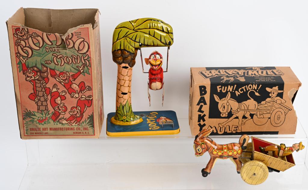 2-MARX & UNIQUE ART tin windup TOYS w/ BOXES: Lot includes a Marx Balky Mule in excellent working condition with the original box. Also included is a Unique Art Bombo the Monkey with original box. Both worked when tested and are nice condition wi