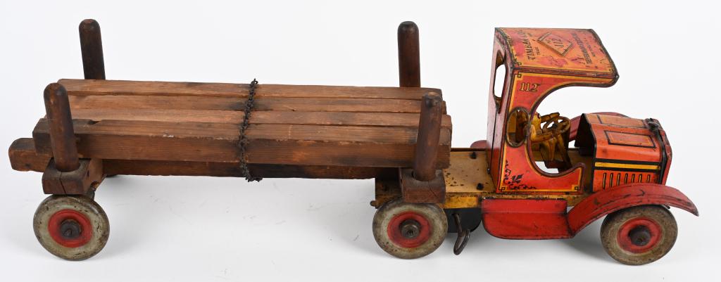 STRAUSS Tin Windup TIMBER KING TRUCK: All original complete with wood load. Windup works. Has loss throughout. 17" Very Good