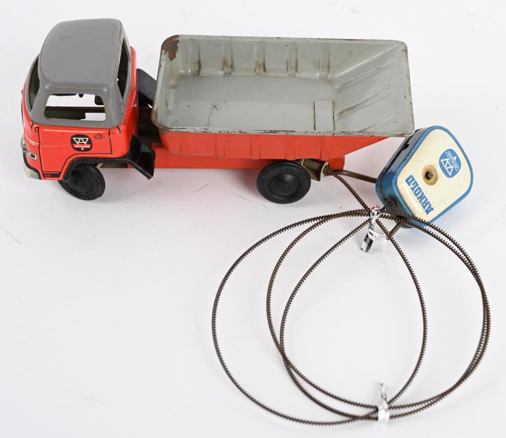 ARNOLD TIN REMOTE DUMP TRUCK: All original and complete with remote. Works. 6 1/2" Excellent