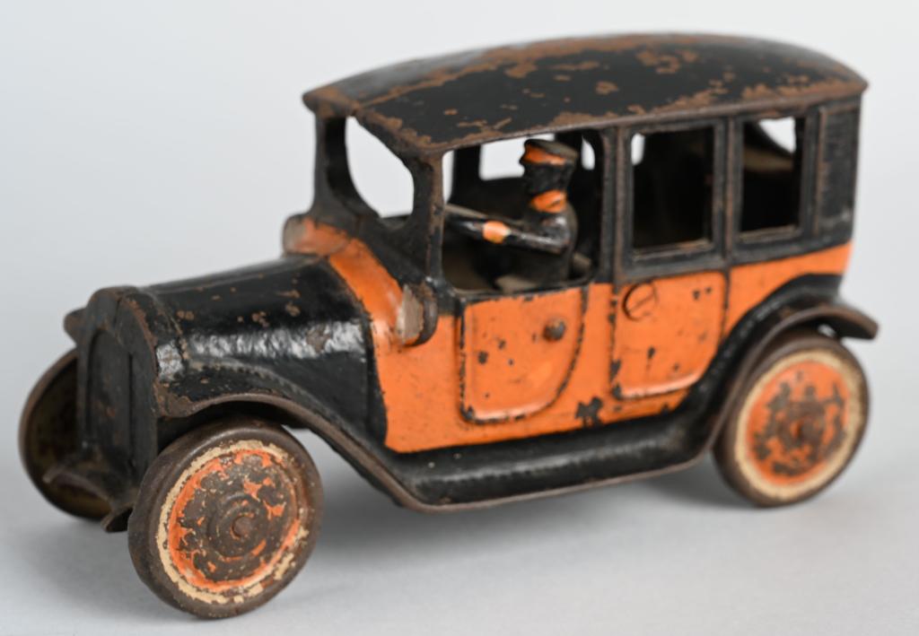 FREIDAG cast iron TOY YELLOW TAXI: Scarce untouched original cast iron Freidag Yellow Taxi with driver. This is the largest size that measures 7 1/4". No cracks or breaks. Missing spare tire. Freidag went out of business during the dep