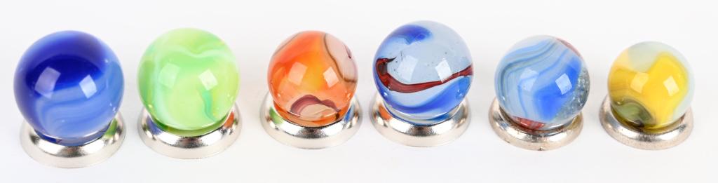 6-AKRO AGATE OXBLOOD AND RARITY: SIze ranges from 9/16 to 11/16. Mint minus. Lot contains a rare lemon / limeade.