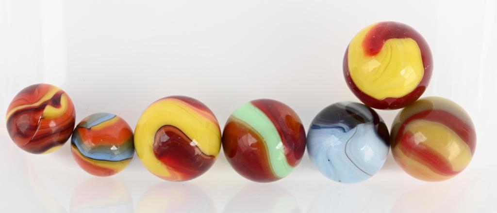 Assorted Akro Agate Shooter Marbles: 7 Akro shooter marbles range from 1" to 3/4". condition is mint - to nm