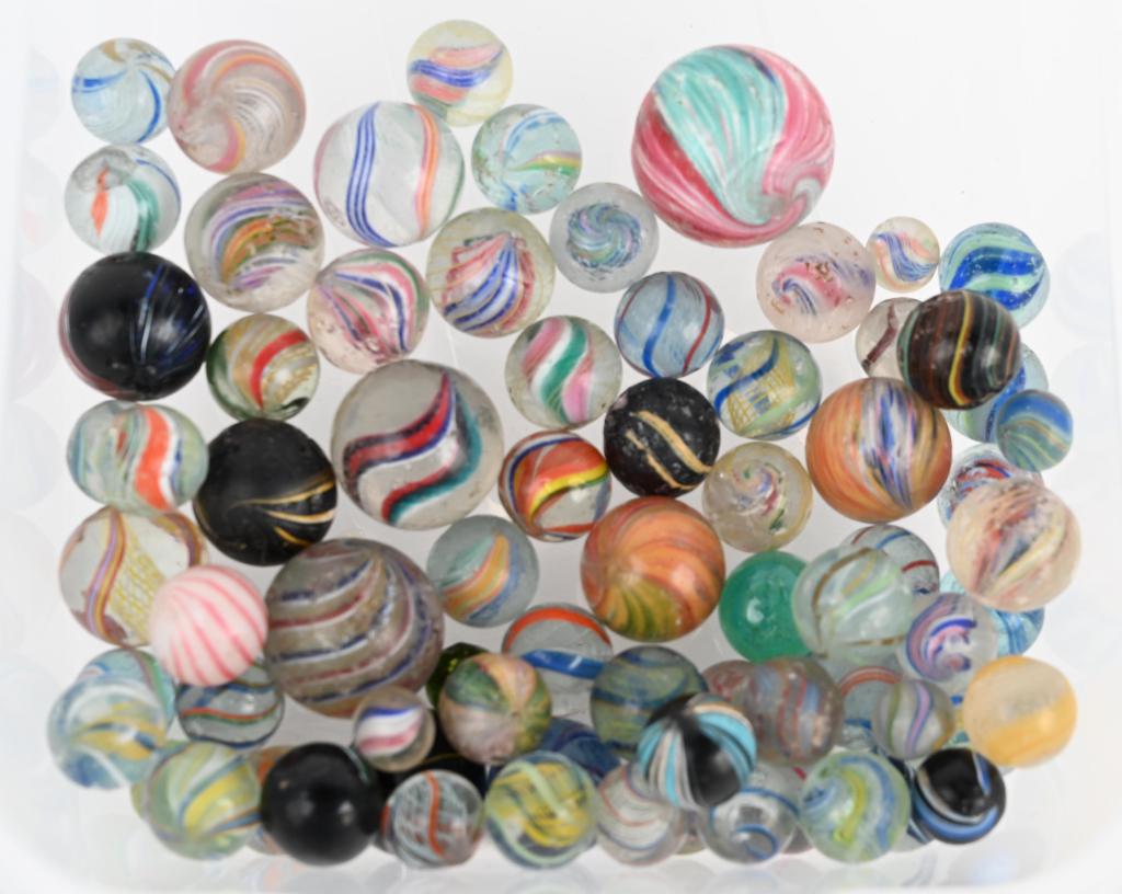 70+ HANDMADE MARBLES: Lot includes mulitcolor, swirls, onionskins, indians, mica and clambroth marbles. Size 1/2"-1 3/16" diameter. Condition varies Good-Excellent