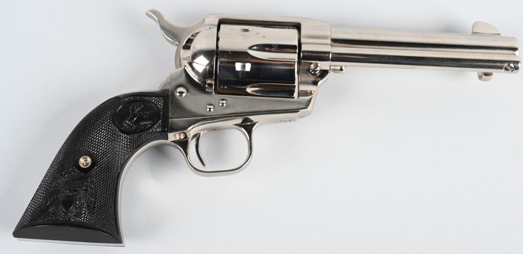 UNFIRED NICKLE COLT SINGLE ACTION ARMY REVOLVER: SERIAL S18232A. BARREL 4 3/4". CALIBER .45 LONG COLT. This is a desirable short barrel .45 in nickel finish with Colt eagle grips. Cylinder shows no signs of any burn. Just a minor handling mark or tw