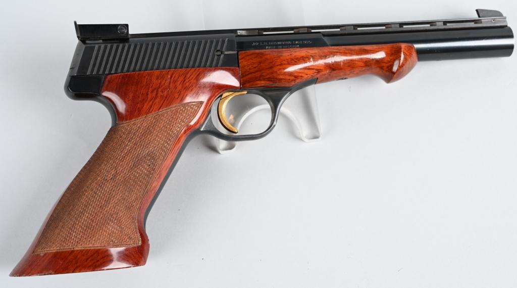 BROWNING MEDALIST .22 SEMI AUTO TARGET PISTOL: SERIAL 60477T74. BARREL 6 3/4". CALIBER .22 LR. MADE IN 1974. Only 906 of these were made that year. Made in Belgium, it is considered one of the finest target .22 auto' ever made with beautiful check