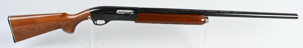 REMINGTON MODEL 1100 SEMI AUTO SHOTGUN: SERIAL L593929V. BARREL 28". CALIBER 12 GA. CHOKE MOD. CHAMBER-2 3/4". LOP-14". Features a full vent rib, single bead sight, blue finish with etched engraving on frame, press checkered pistol grip wal
